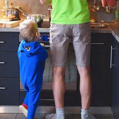 image of man and child in kitchen
